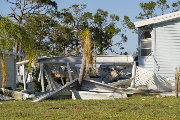 Natural disaster consequences. Severely damaged by hurricane mobile homes in Florida residential area.